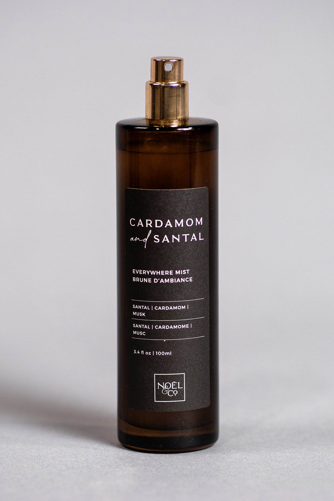 A bottle of NOEL & Co 'CARDAMOM & Santal' everywhere mist.
